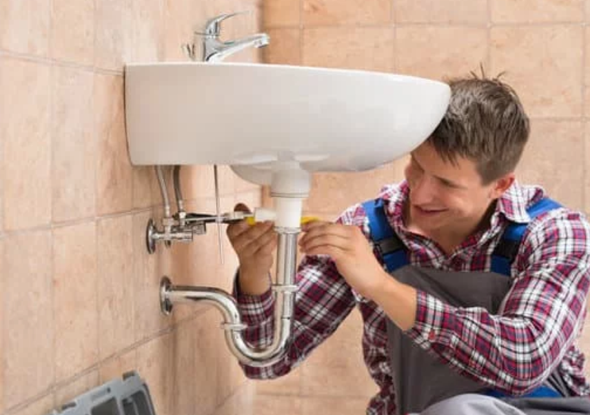 professional plumber fitting bathroom sink